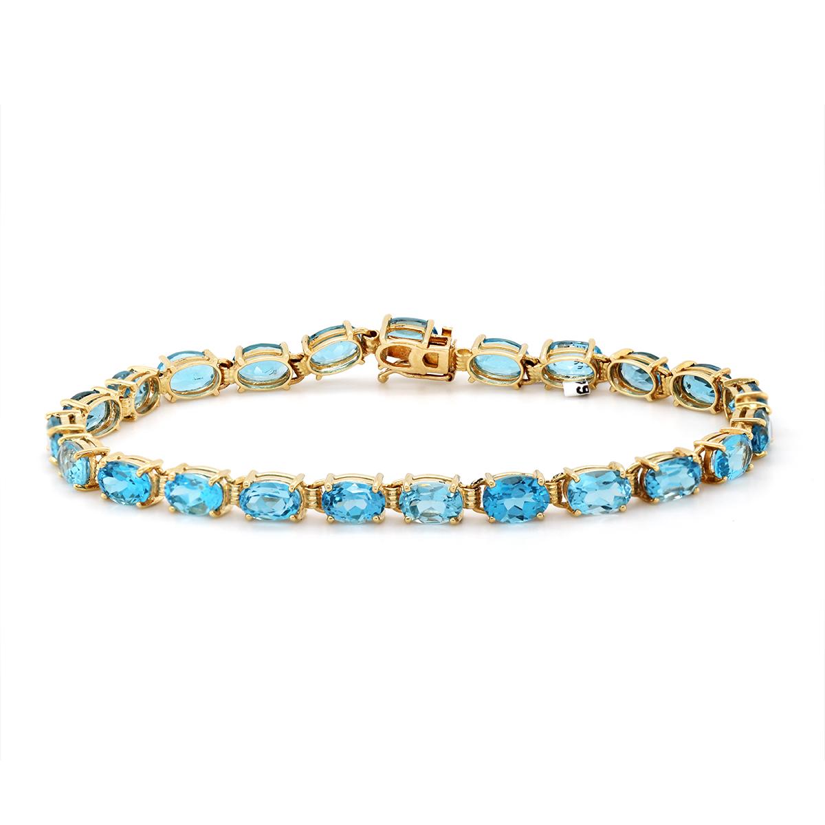 YELLOW GOLD OVAL BLUE TOPAZ BRACELET