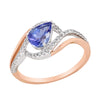 MODERN TWO-TONE GOLD BYPASS STYLE FASHION RING WITH TANZANITE AND DIAMONDS, .18 CT TW