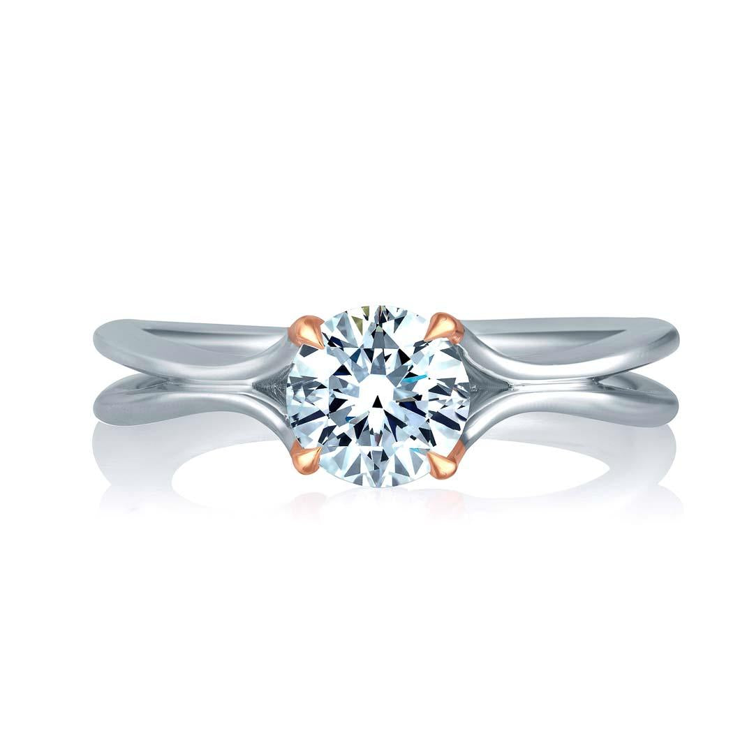 14k white and rose gold solitaire ring setting. This ring is a size 6.5. Center diamond sold separately.